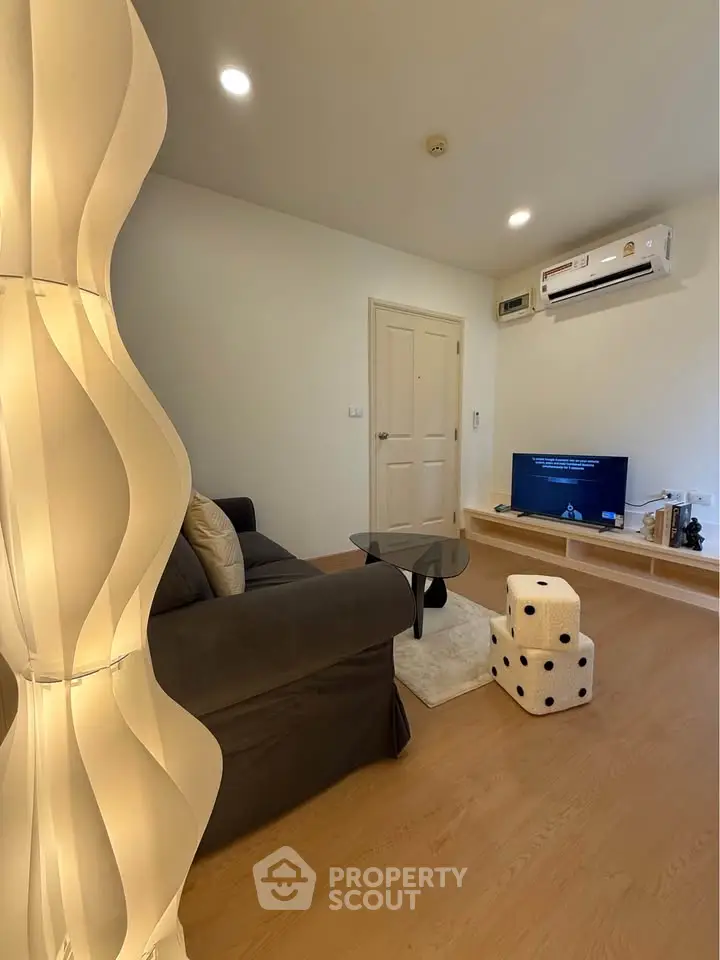 Modern living room with stylish lighting and cozy seating area