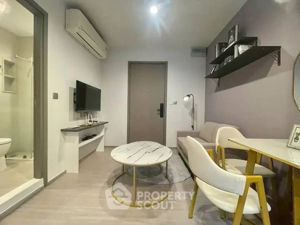Modern living room with stylish furniture and air conditioning in a cozy apartment.