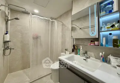 Modern bathroom with sleek design and illuminated mirror