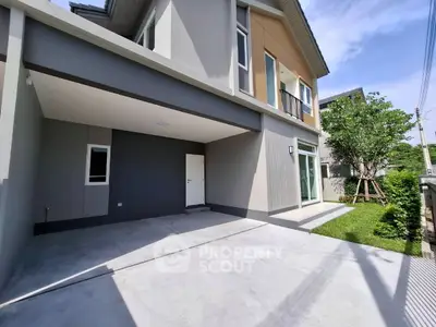 Modern two-story house with spacious driveway and lush green lawn