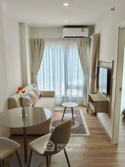 Modern living room with cozy seating and natural light