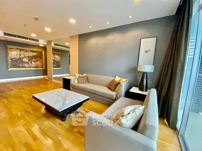 Luxurious living room with elegant decor and hardwood floors in modern apartment.
