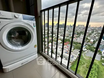 High-rise balcony with washing machine and stunning city view