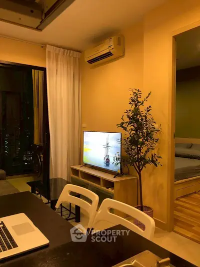 Cozy modern apartment living room with TV and air conditioning