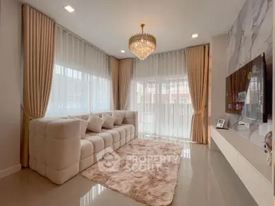 Luxurious living room with elegant chandelier and plush sofa in modern apartment