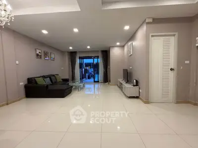 Spacious modern living room with sleek design and ample natural light