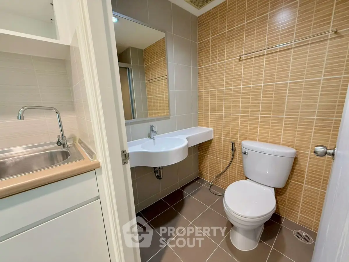 Modern bathroom with sleek fixtures and neutral tile design