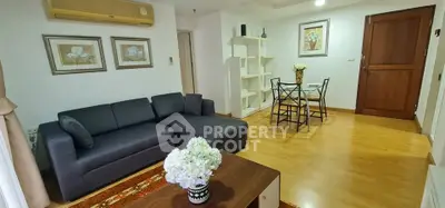 Spacious living room with modern decor and wooden flooring