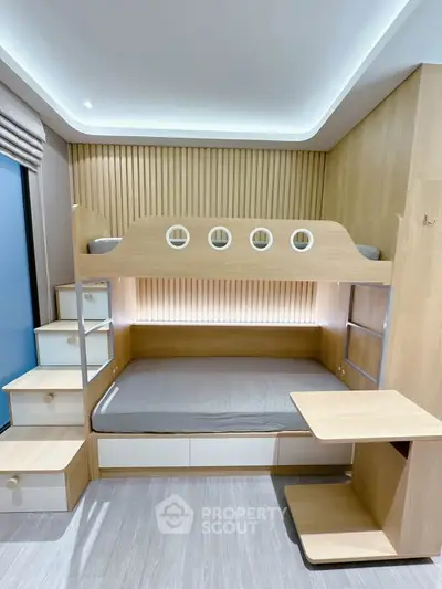 Modern bedroom with stylish bunk bed and built-in storage solutions