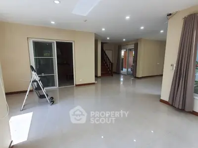 Spacious living room with modern design and ample natural light