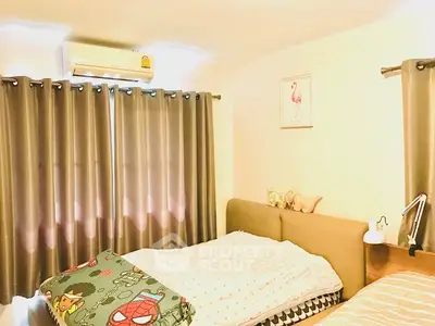 Cozy bedroom with double bed, air conditioning, and stylish curtains