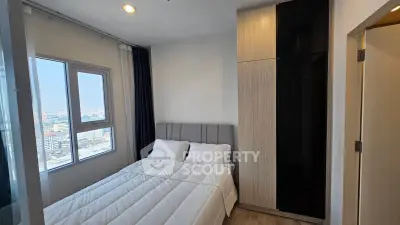 Modern bedroom with city view and sleek wardrobe