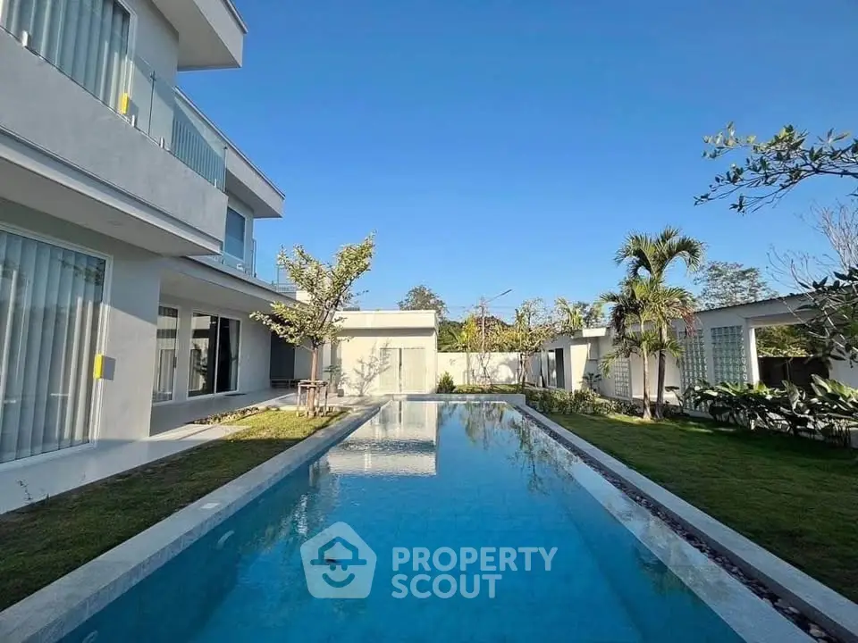 Luxurious modern villa with private pool and lush garden, perfect for serene living.