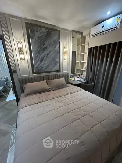 Luxurious bedroom with elegant decor and modern lighting, featuring a cozy bed and stylish furnishings.