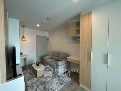 Modern living room with cozy sofa and stylish decor