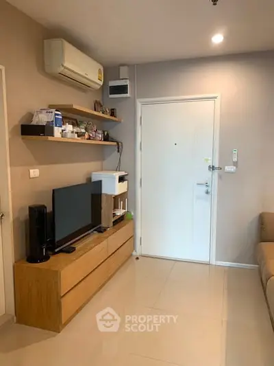 Modern living room with sleek furniture and air conditioning