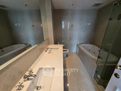 Luxurious bathroom with modern fixtures and spacious bathtub