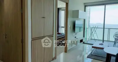 Modern living room with ocean view balcony and sleek interior design