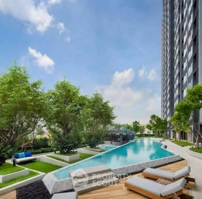 Luxurious high-rise building with stunning pool and lush garden view.