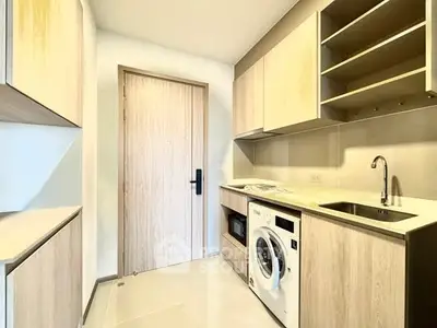 Modern kitchen with wooden cabinets and built-in appliances