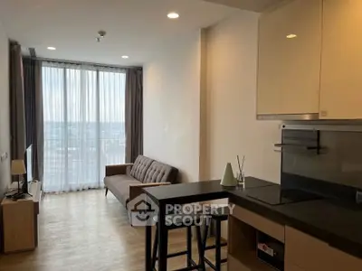 Modern living room with open kitchen and large window view