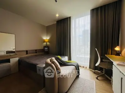 Modern bedroom with large window and stylish decor in urban apartment