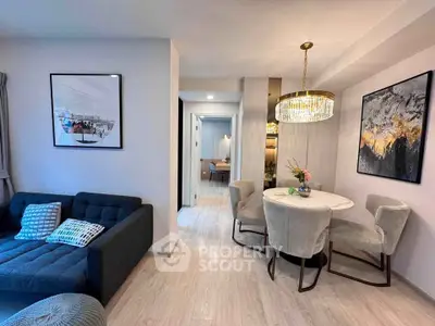 Modern living room with elegant dining area and stylish decor