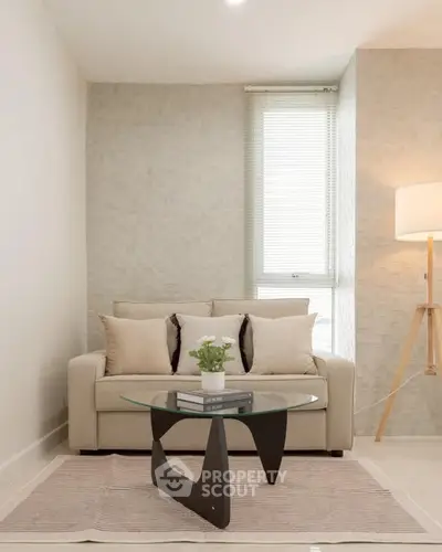 Modern living room with stylish sofa and glass coffee table