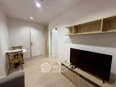 Modern living room with wooden flooring and minimalist furniture