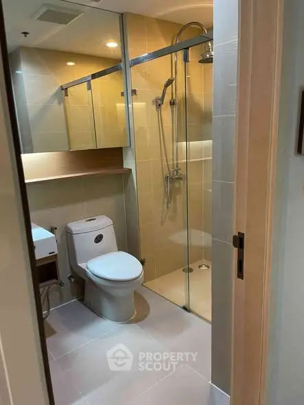 Modern bathroom with glass shower and sleek fixtures