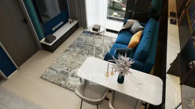 Modern living room with stylish decor and balcony view