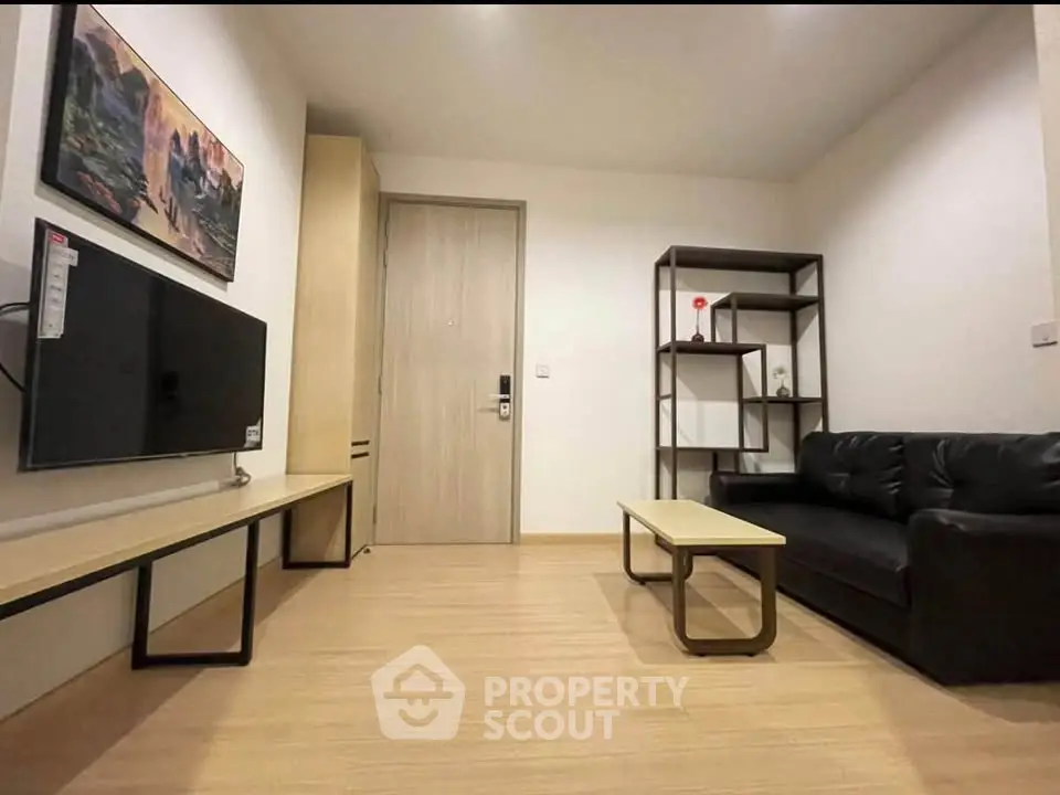 Modern living room with sleek furniture and wall-mounted TV, perfect for cozy relaxation.