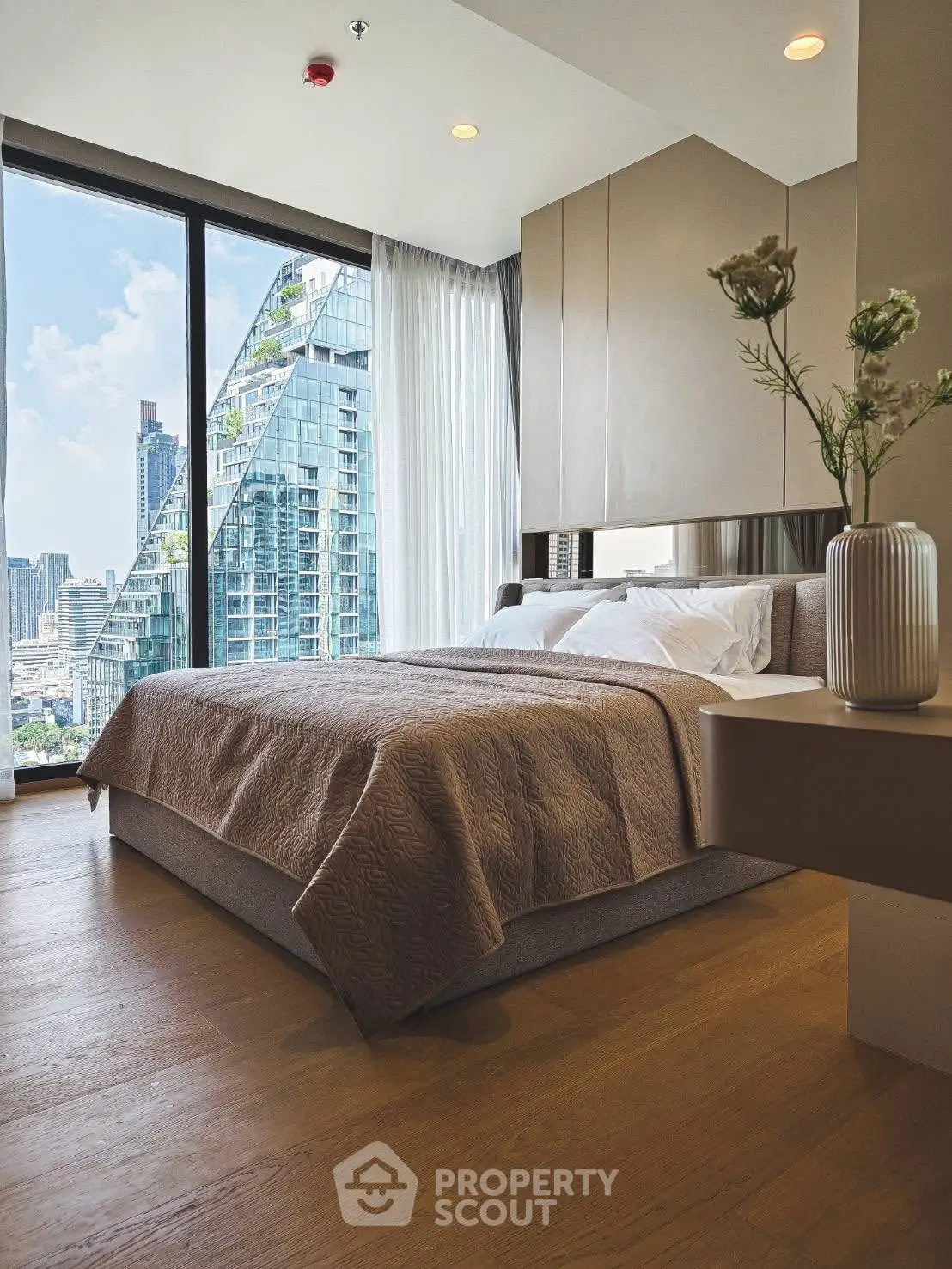 Luxurious bedroom with stunning city view and modern decor