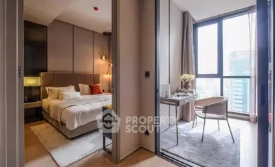 Modern bedroom with study area and large windows in a luxury apartment
