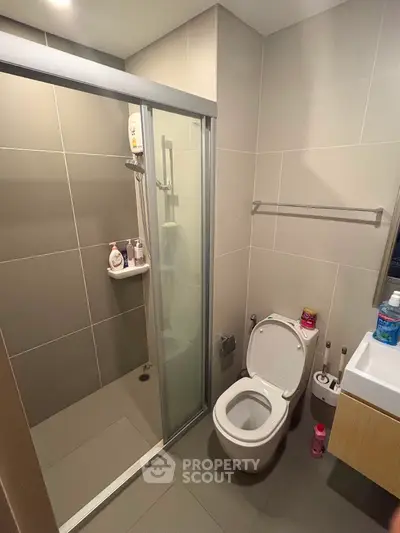 Modern bathroom with shower and toilet in sleek design