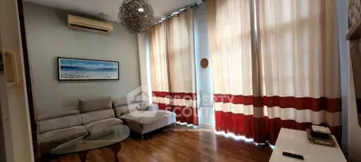 Stylish living room with modern decor and large windows