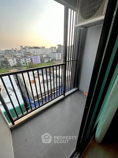 Charming balcony with city view, perfect for relaxing and enjoying sunsets.