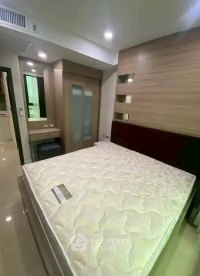 Modern bedroom with stylish wooden accents and comfortable mattress