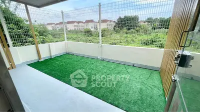 Spacious balcony with artificial grass and scenic view