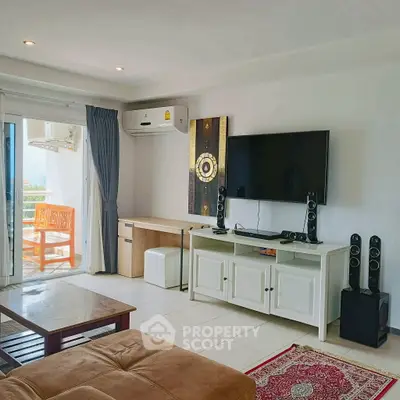 Spacious living room with modern decor and balcony view