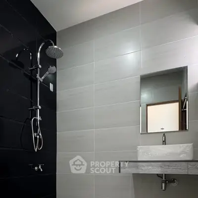 Modern bathroom with sleek shower and minimalist sink design