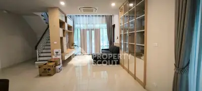 Spacious living room with modern design and large windows for natural light