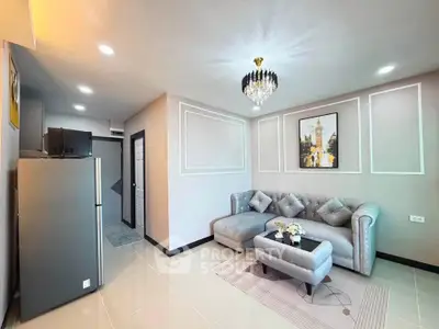 Modern living room with elegant decor and plush seating in a stylish apartment.