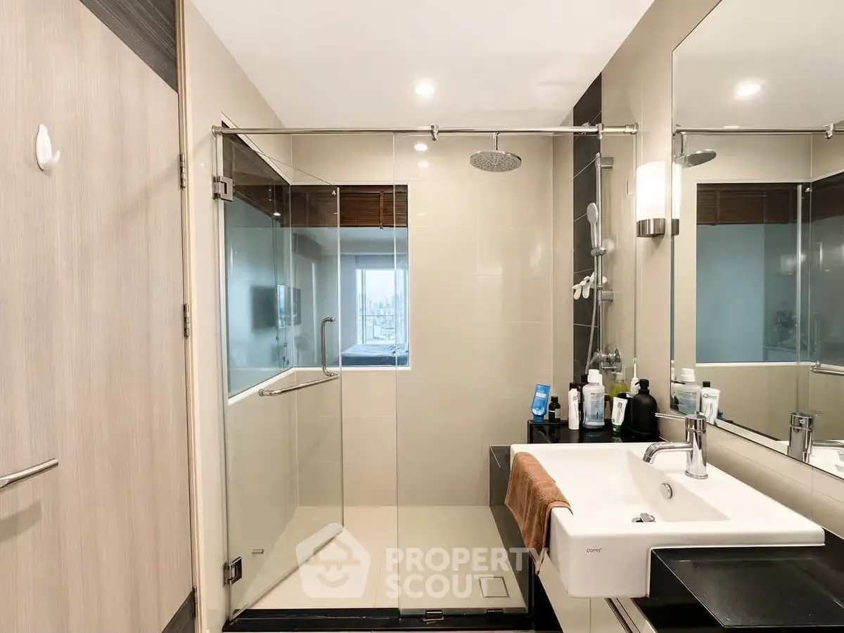Modern bathroom with glass shower and sleek sink design