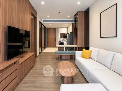 Modern living room with sleek wooden furniture and open layout in a stylish apartment.