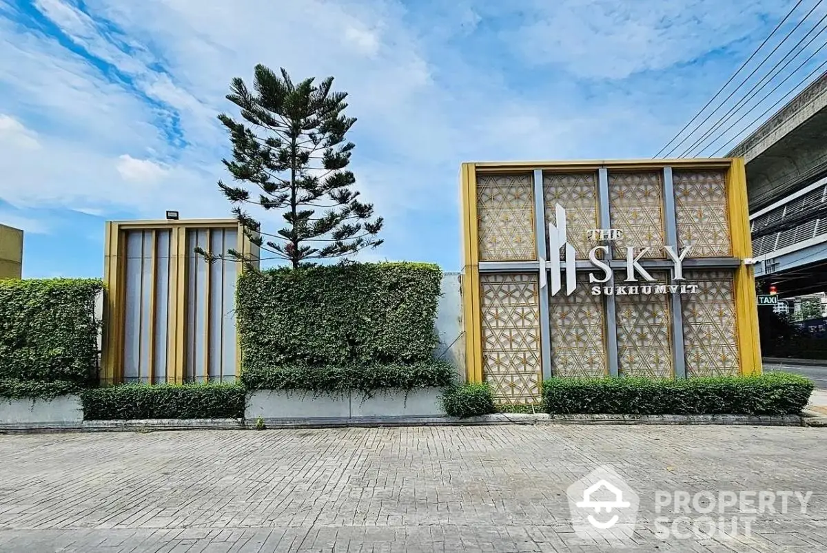 Modern entrance of The Sky Sukhumvit with lush greenery and stylish design