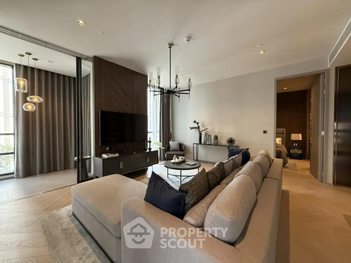 Luxurious modern living room with elegant decor and spacious seating area.