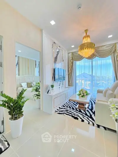 Luxurious living room with elegant chandelier and stunning view, featuring modern decor and plush furnishings.