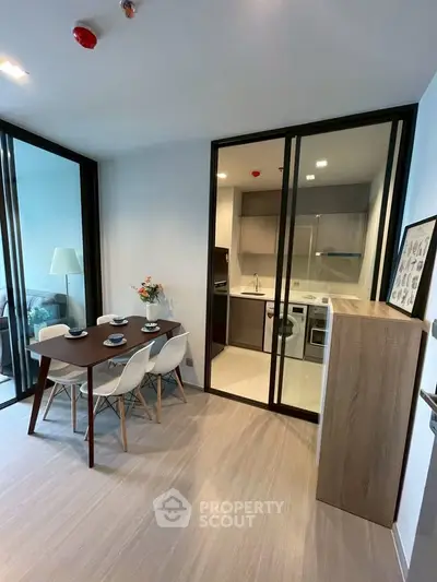 Modern dining area with open kitchen and stylish decor