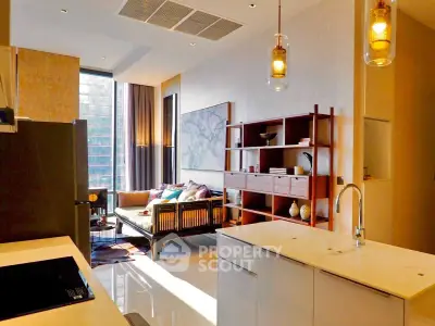 Modern open-layout kitchen and living room with stylish decor and natural light
